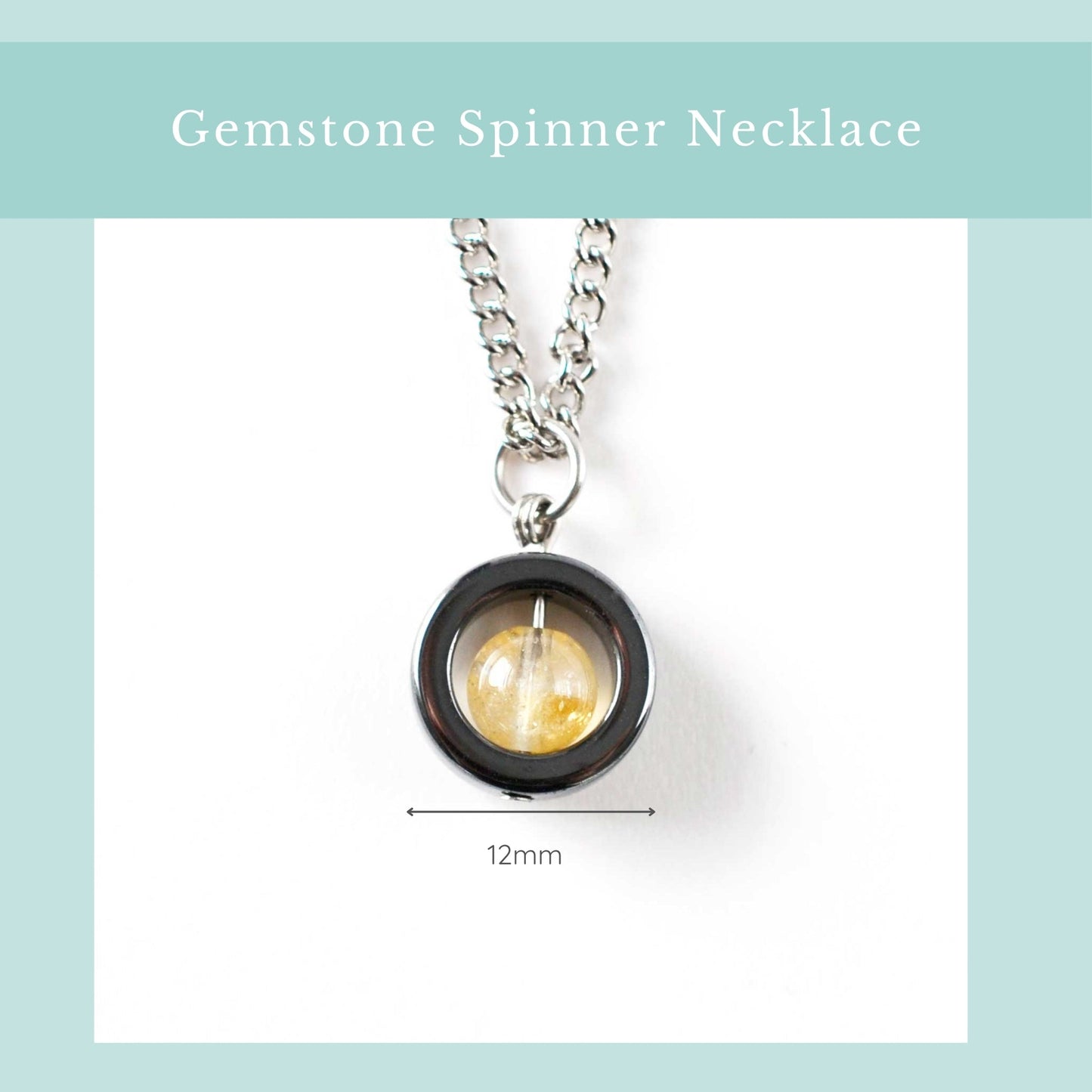 Gemstone spinner necklace with a yellow gemstone on a white background