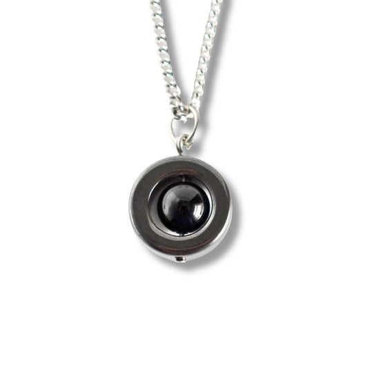 Necklace with a black pendant on a white background