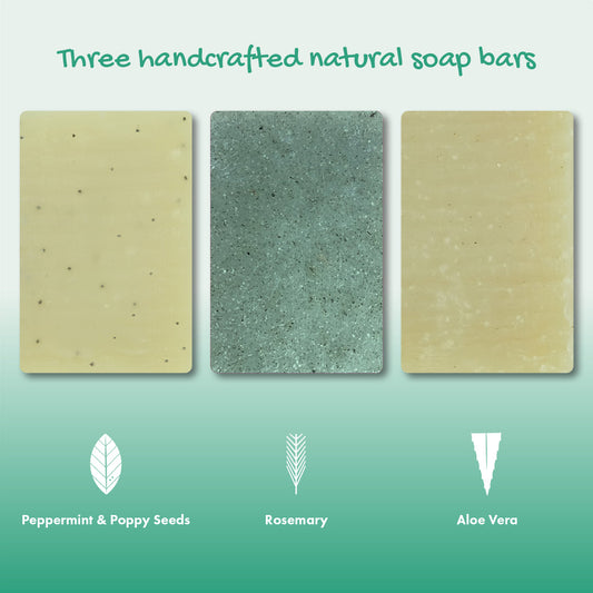 Three handcrafted natural soap bars with labels for ingredients on a green background