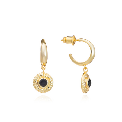 Gold hoop earrings with black stones on a white background