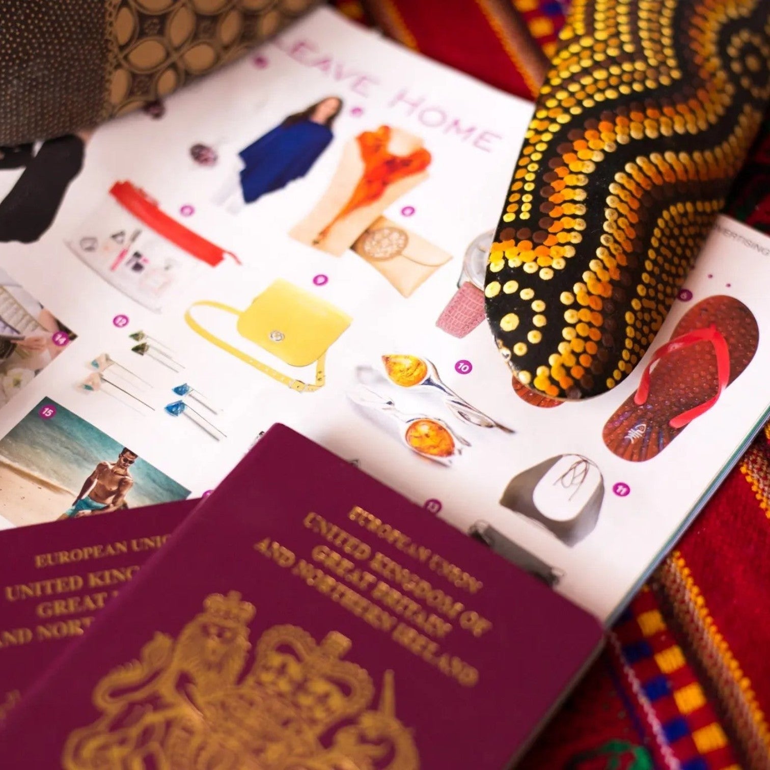 Passports and travel guidebook on a colorful surface