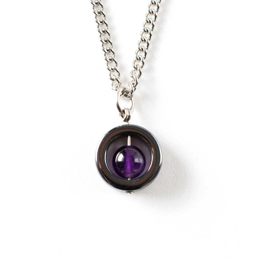 Necklace with a purple gemstone pendant on a white background