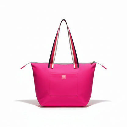 Berry Riot shoulder tote in bright pink cotton twill with pink, red, cream and black striped handles and a front pocket with a pink Apricot Moon label, front view studio shot, handmade in Dorset