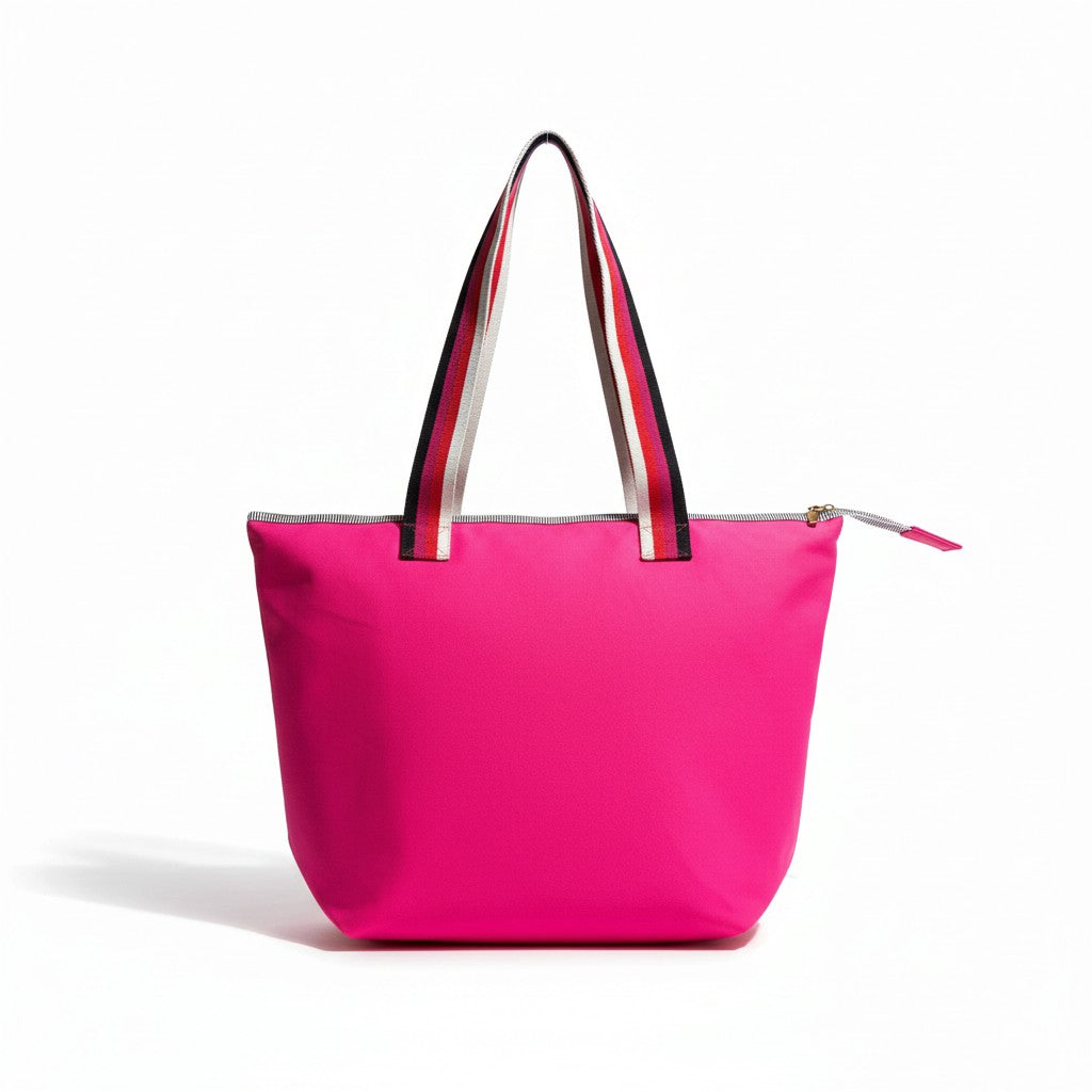 Rear view of the Berry Riot bright pink shoulder tote with striped handles and no pocket, studio shot on a white background