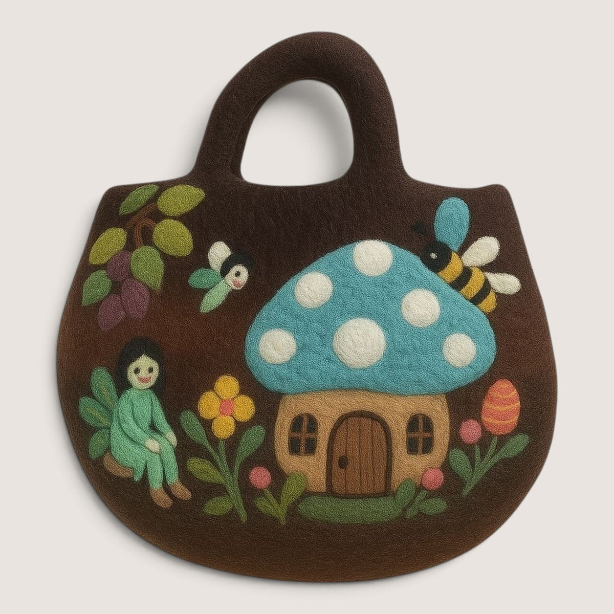 Fairy Garden Felted Bag in brown, with a felted blue-capped toadstool house, a fairy, a bee, flowers and plums