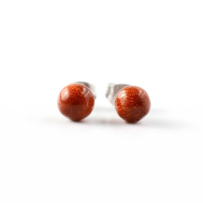 Pair of stud earrings with clear gemstones on a white background