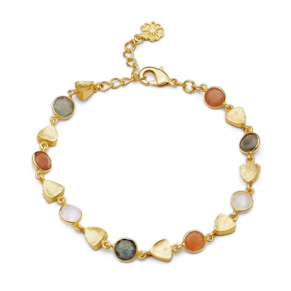 Gold bracelet with multicolored stones on a white background