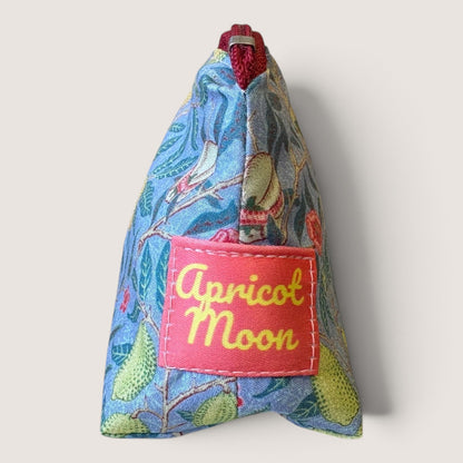 End view of the Garden Fruits pencil case showing the Apricot Moon label