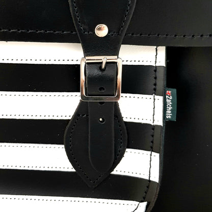 Black and white striped bag with a leather strap and visible brand logo.
