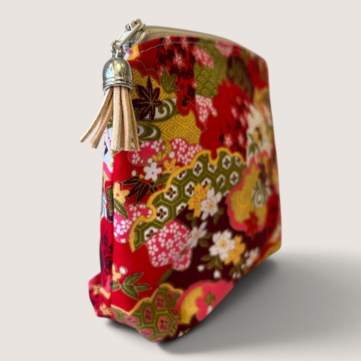 End view of the Isumi Red Japanese everyday pouch showing the Apricot Moon label