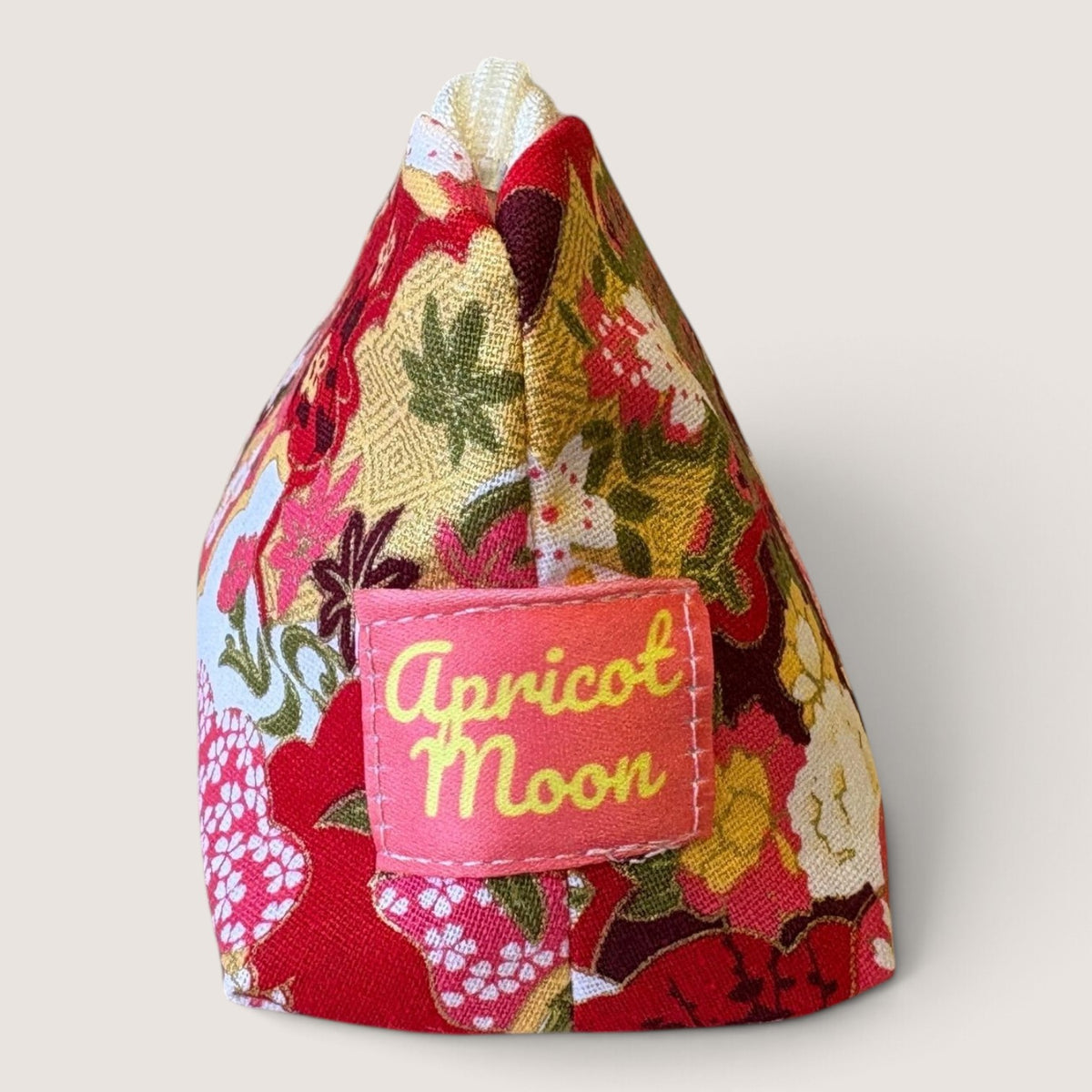 End view of the Isumi Red Japanese pencil case showing the Apricot Moon label