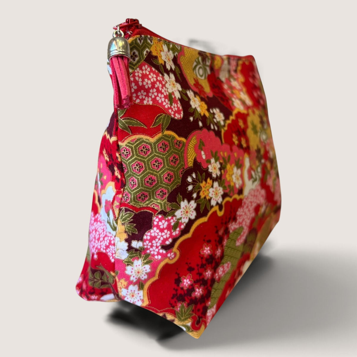 End view of the Isumi Red Japanese wash bag showing the Apricot Moon label