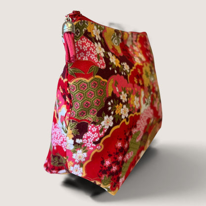 End view of the Isumi Red Japanese wash bag showing the Apricot Moon label