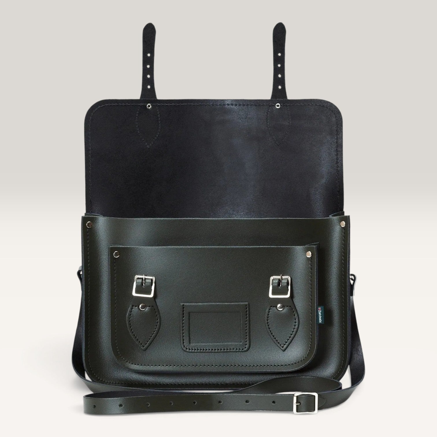 A black leather messenger bag with a front pocket, silver buckle details, and a detachable shoulder strap, shown against a neutral light gray background.