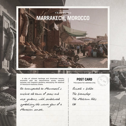 Travel postcard to Marrakech, Morocco with market scene and handwritten text.