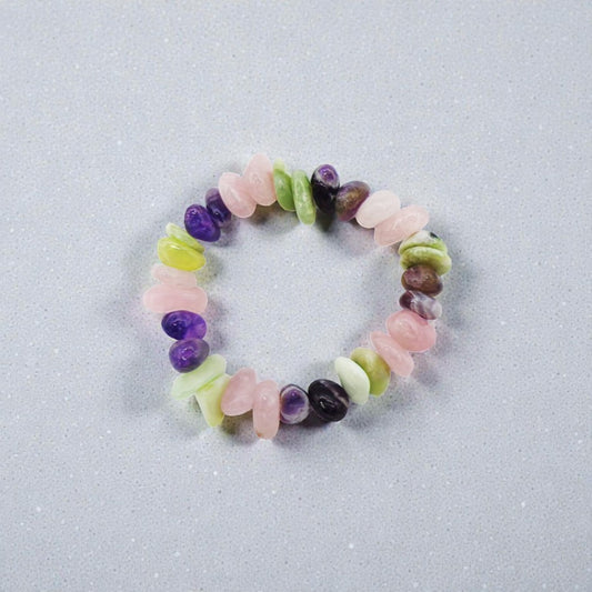 Multicolored beaded bracelet on a light gray background