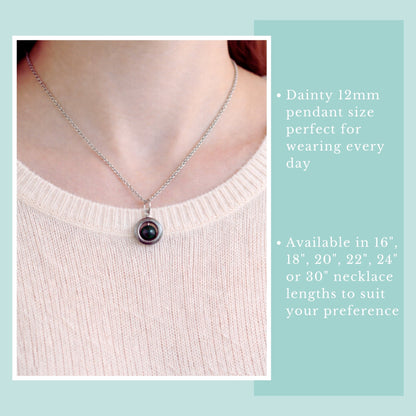 Necklace with a purple pendant worn by a person, on a light blue background with text about necklace length options.