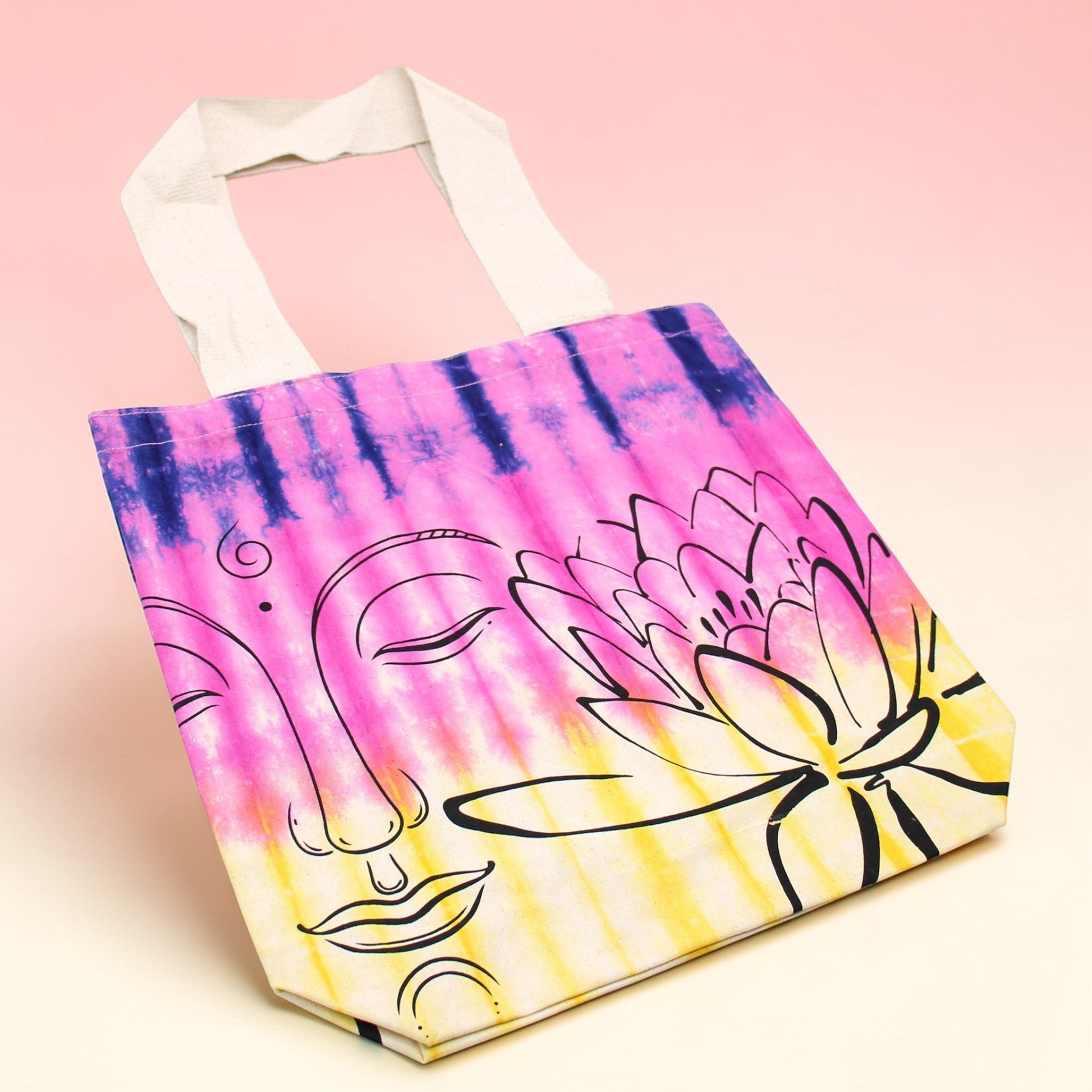 Tote bag with tie-dye design and abstract art on a pink background