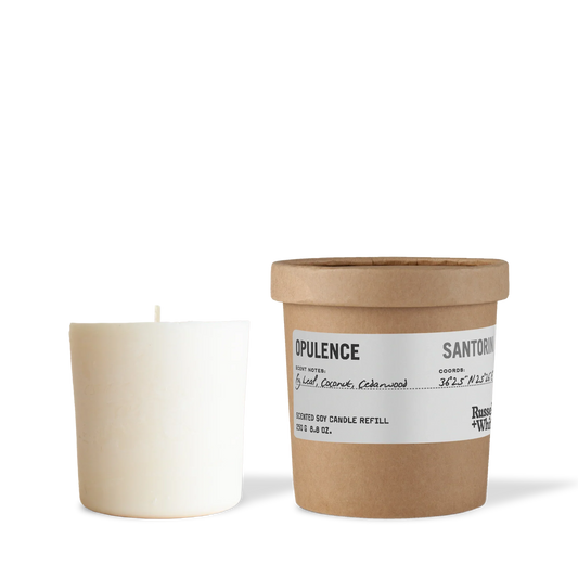 Candle and its packaging on a white background