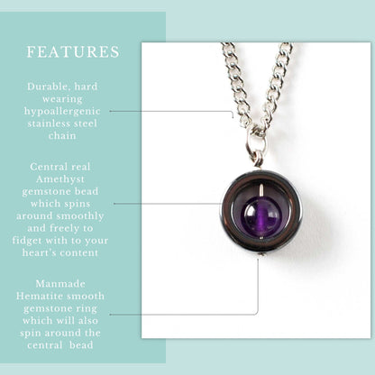 Necklace with a central amethyst gemstone bead on a light blue background