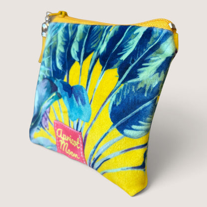 Palm Springs velvet purse in a second angled view, showing the Apricot Moon label on yellow palm print velvet with a yellow zip