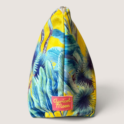 End view of the Palm Springs velvet wash bag showing the Apricot Moon label on yellow palm print velvet
