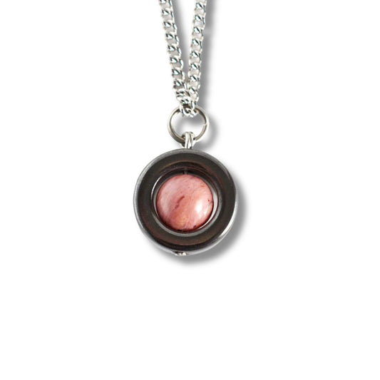 Necklace with a pink stone pendant on a white background