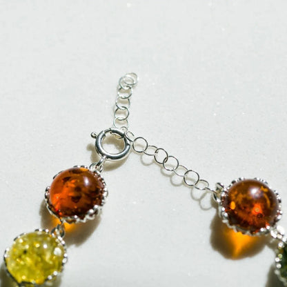 Jewelry with amber-colored stones on a light background