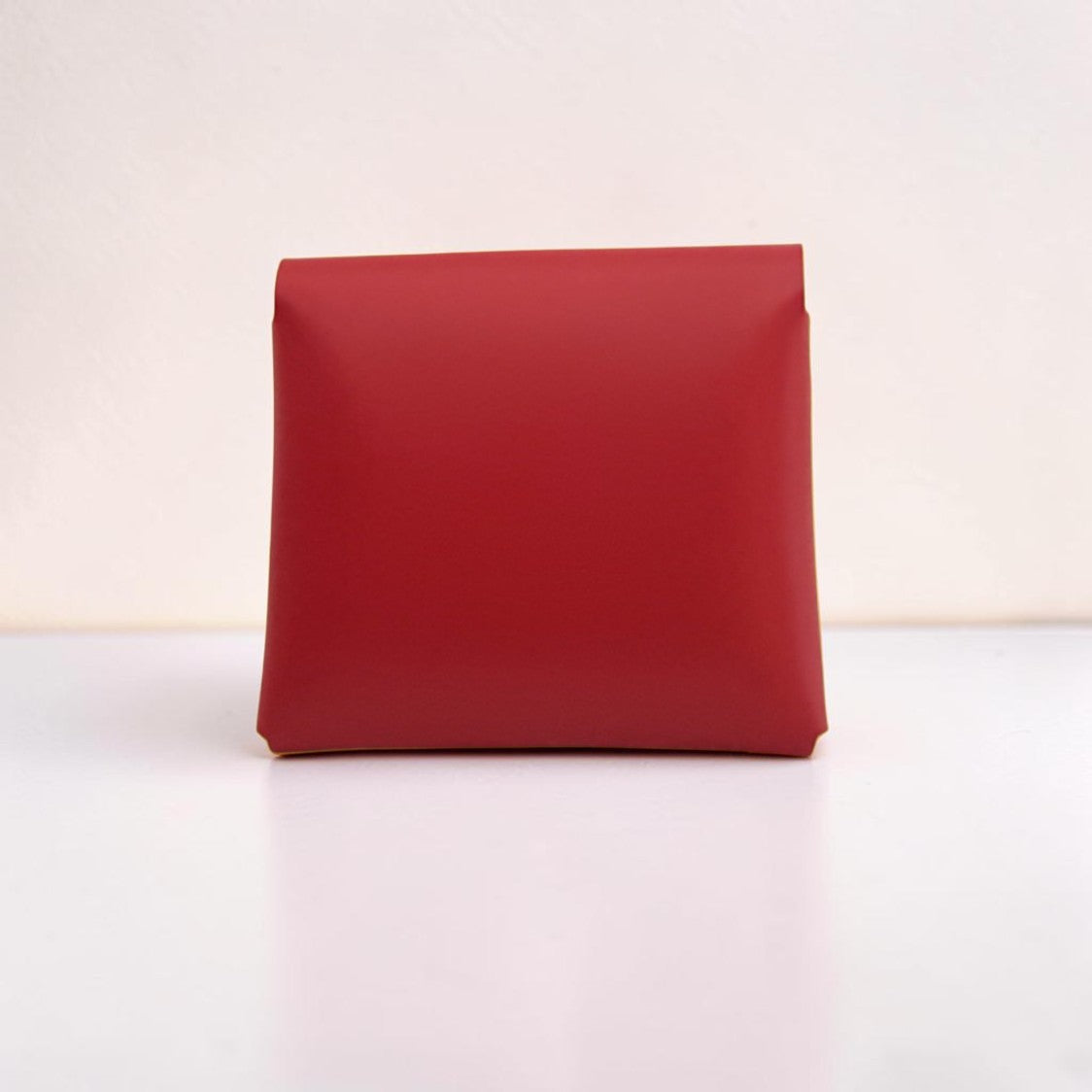 Red rectangular pouch on a white background