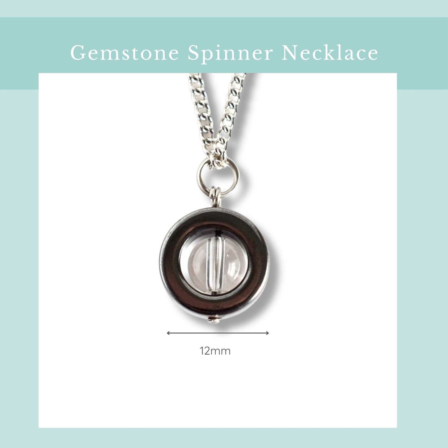 Gemstone spinner necklace with a clear gemstone on a light blue background