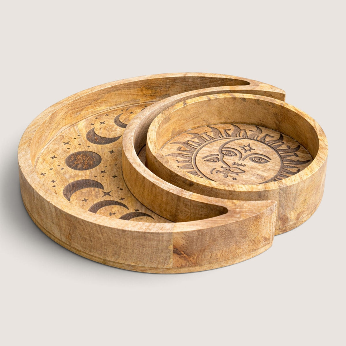 Sun and Moon wooden tray set nested together, angled view showing the carved moon phases and sun and moon face
