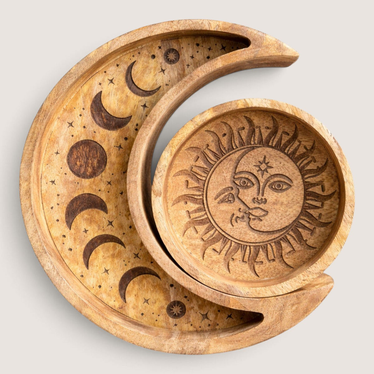 Sun and Moon wooden tray set with the round sun tray nested inside the crescent moon tray, seen from above