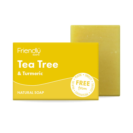 Tea Tree & Turmeric soap bar with packaging on a white background