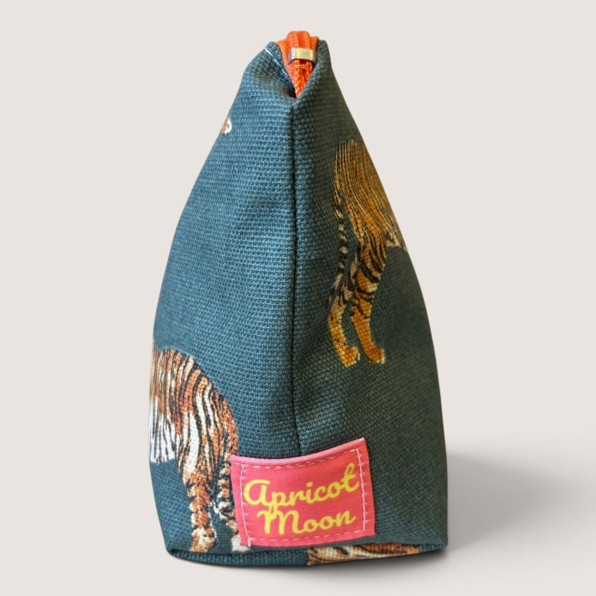 End view of the Tiger Tiger everyday pouch showing the Apricot Moon label