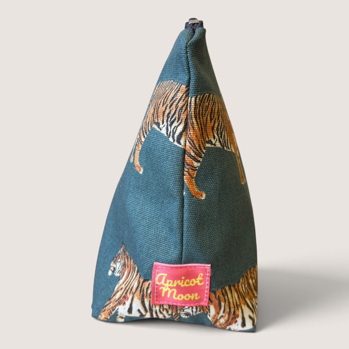 End view of the Tiger Tiger wash bag showing the Apricot Moon label