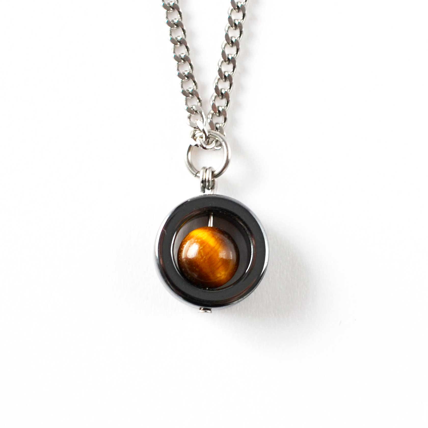 Necklace with a round pendant featuring a tiger's eye stone on a white background