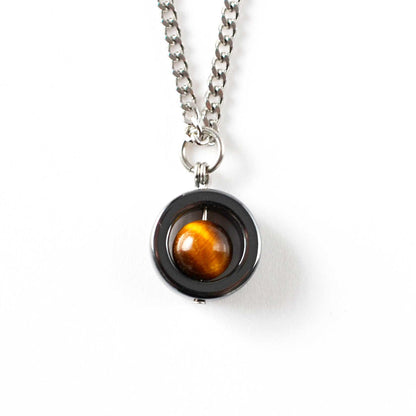 Necklace with a round pendant featuring a tiger's eye stone on a white background