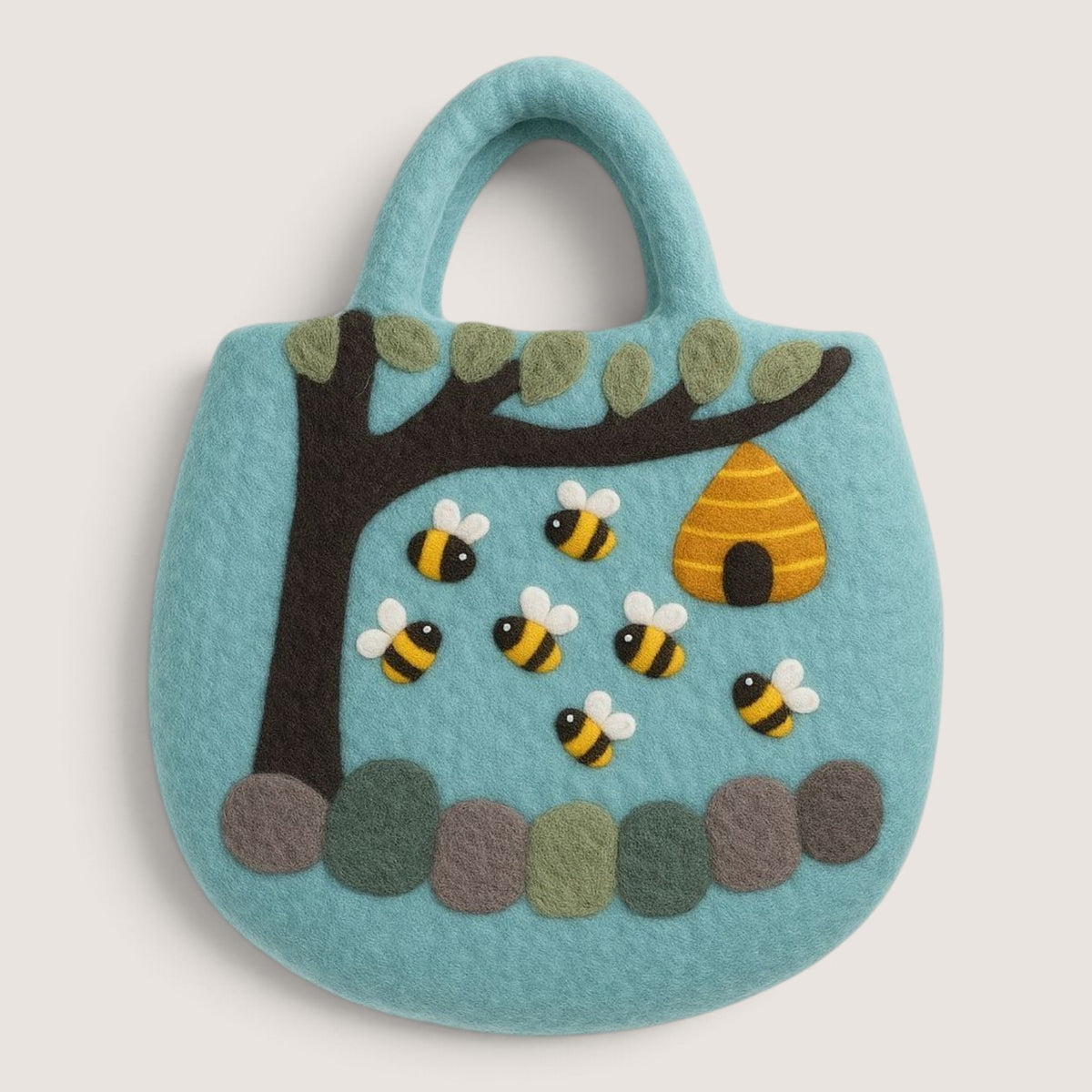 Tree and Beehive Felted Bag in turquoise, with a felted tree, seven bees, a beehive and a row of stones