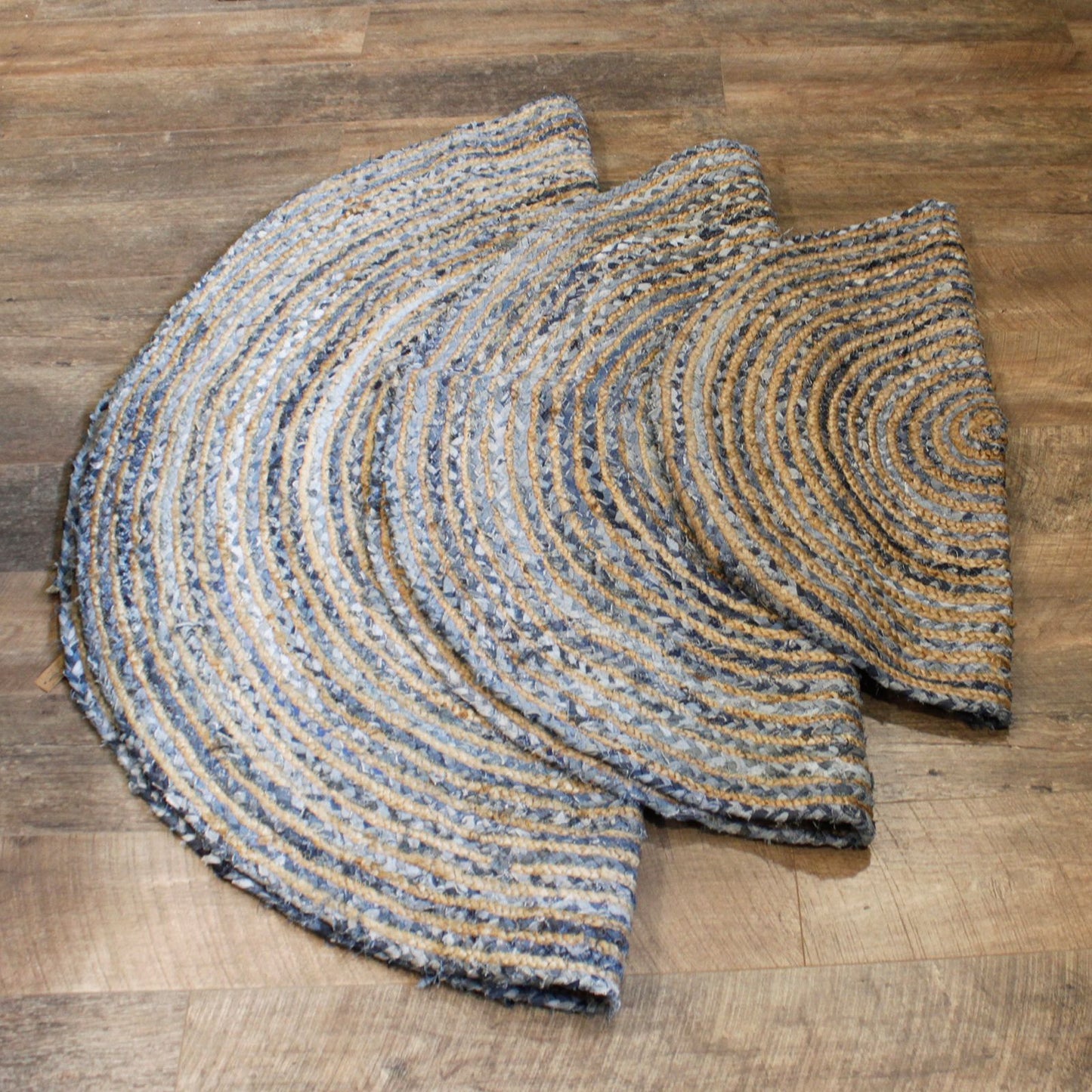 Round braided rug on a wooden floor