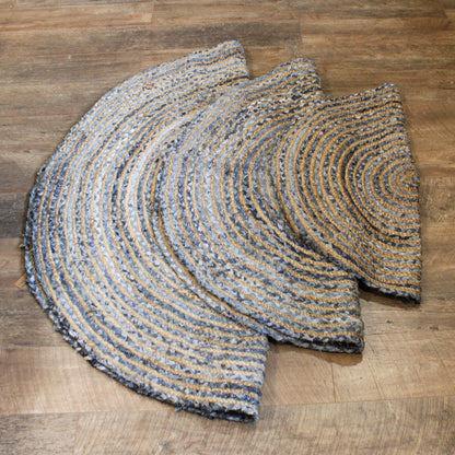Round braided rug on a wooden floor