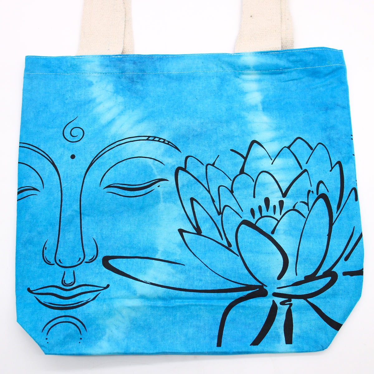 Blue tote bag with black line art of a face and lotus flower on a white background
