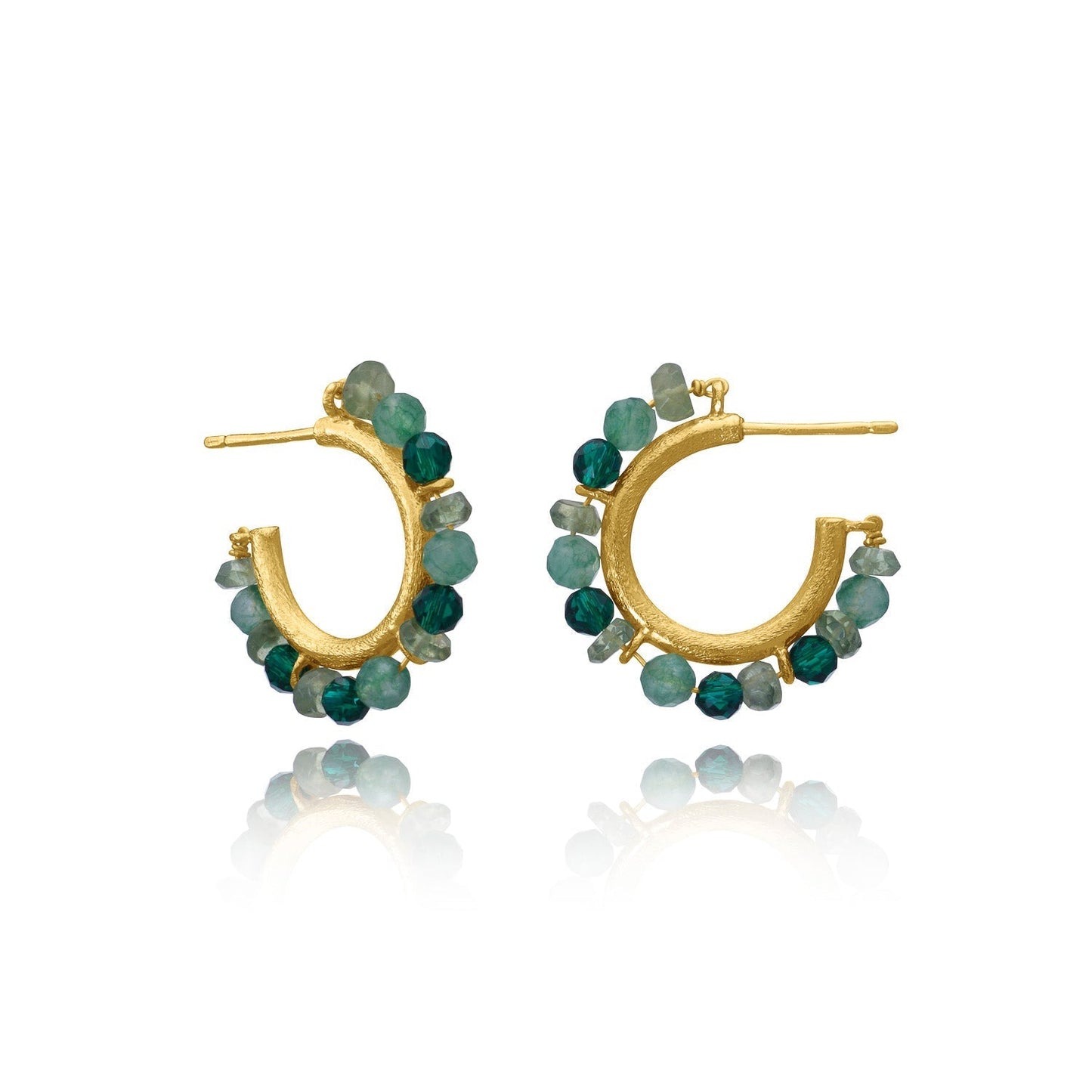 Gold hoop earrings with green gemstones on a white background