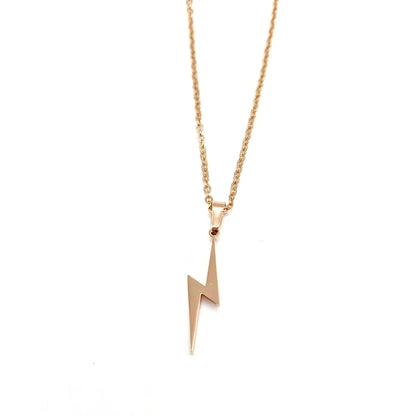 Rose gold lightning bolt necklace on a white background