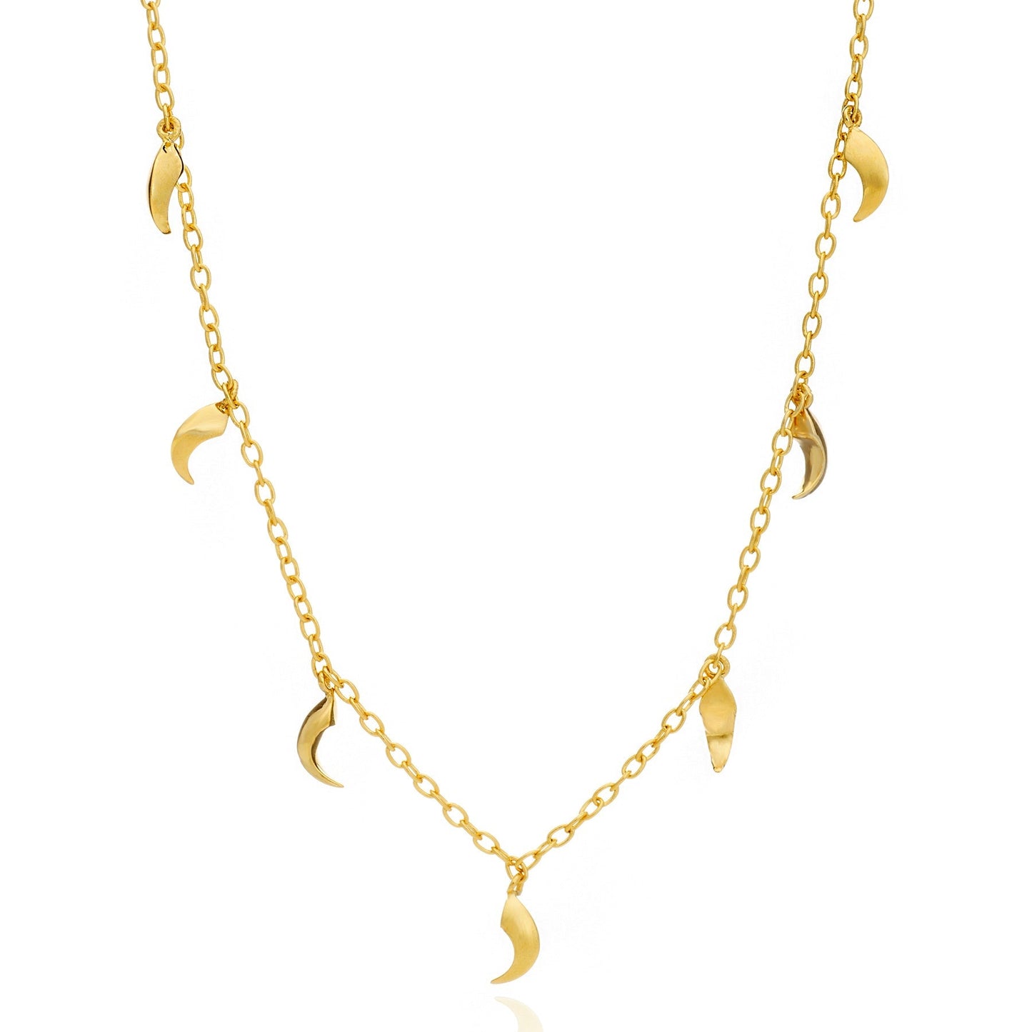 Gold necklace with moon-shaped pendants on a white background
