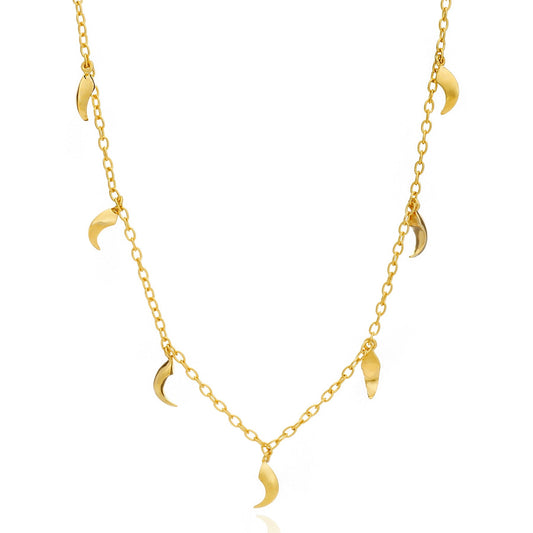 Gold necklace with moon-shaped pendants on a white background