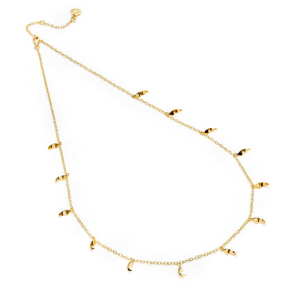 Gold necklace with small pendants on a white background