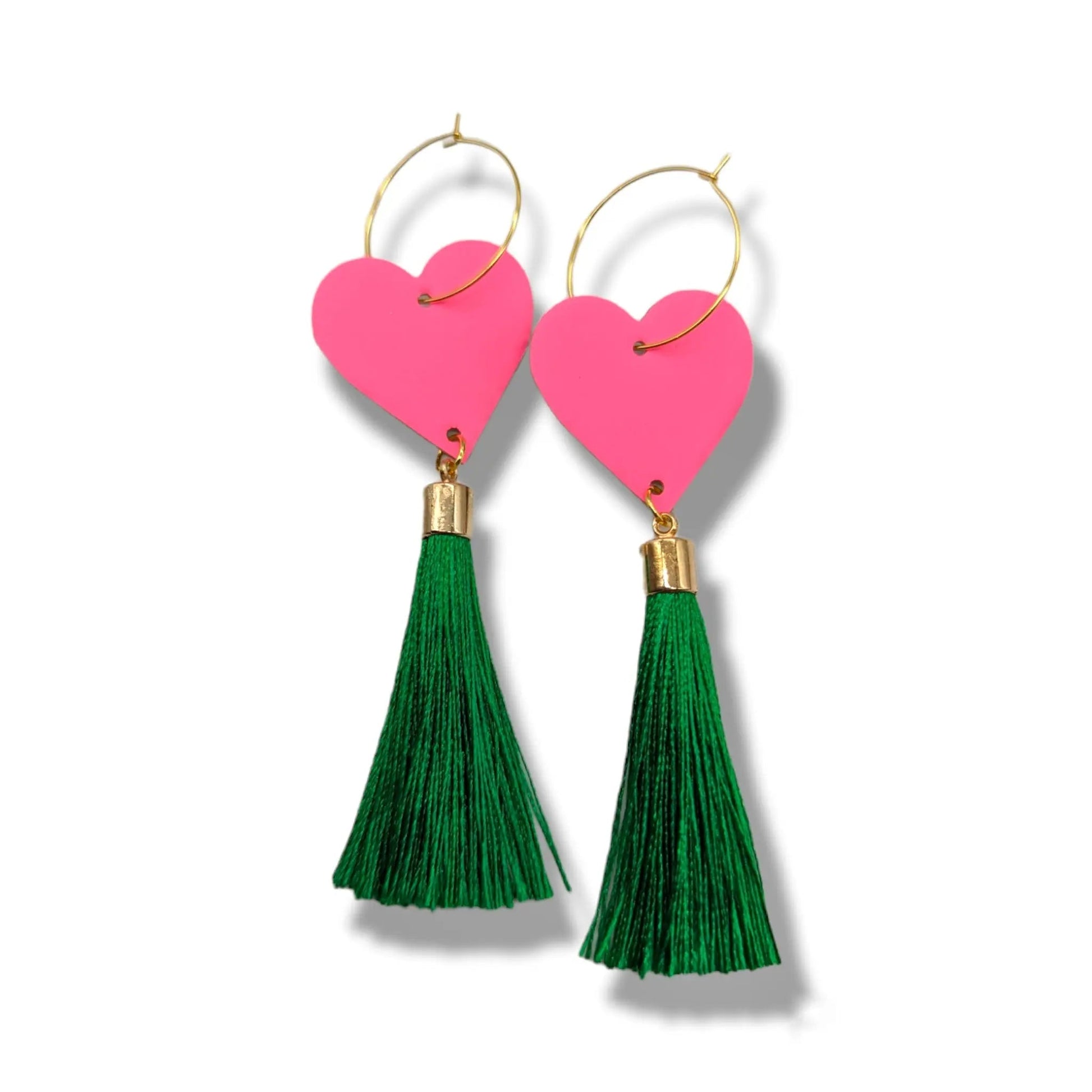 Heart-shaped earrings with green tassels on a white background