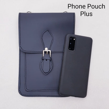 Navy blue phone pouch with strap and matching phone case on a light gray background