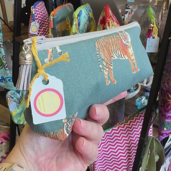 Hand turning the Tiger Tiger pencil case to show the print, zip and tassel in the Apricot Moon shop