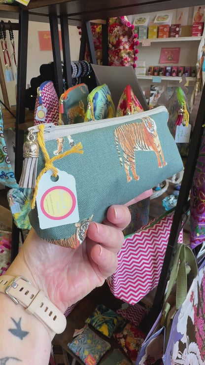 Hand turning the Tiger Tiger pencil case to show the print, zip and tassel in the Apricot Moon shop